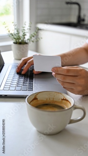 Online shopping e-commerce payment concept with laptop credit card and coffee on table
