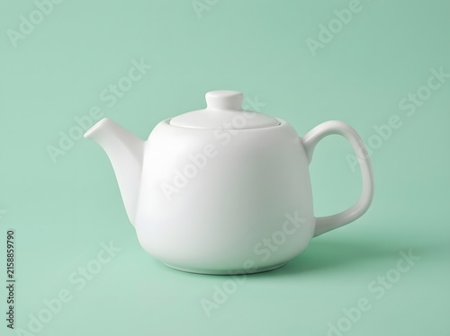 Minimalist White Ceramic Teapot on a Soft Mint Green Background