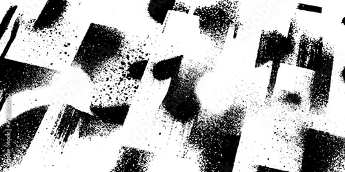 Abstract spray paint textures in black and white with sharp geometric shapes and textured splatters