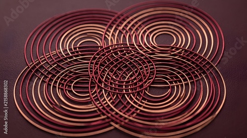 Intersecting Metallic Bronze Rings 3D Abstract Geometric Circles on Burgundy Surface