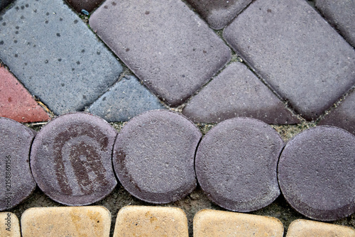 cobblestone driveway paving and sealant background closeup of freshly sealed drive
