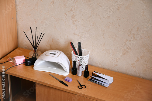Nail care tools and items ready for use in a beauty salon setting during the day