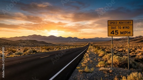 Desert Highway Sunset Speed Advisory Sign In Vast Landscape