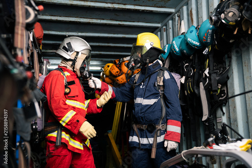 Fotografía Firefighter performing safety partner check on breathing apparatus