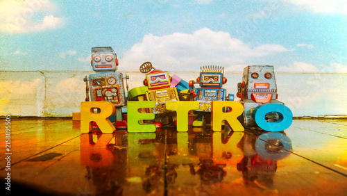 RETRO word with retro roys on a wooden floor and postcard sky 