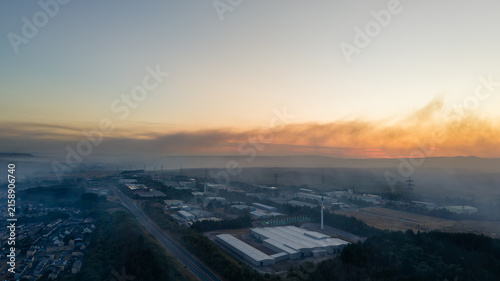Fotografie Dense smoke plume from hill fires around Llangynidr obscuring valley floor at du