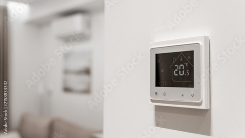 Fotografie white thermostat for underfloor heating and climate control systems