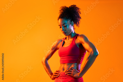 Fotografie Sportive black hispanic woman wearing sportswear training