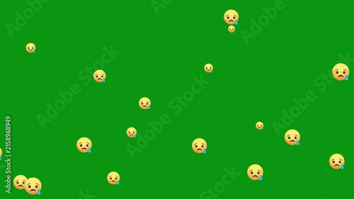 Yellow sad face emoji with a tear on a green background. Sad but relieved face is a flat animated emoji. Alpha Channel.