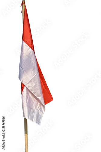 The Indonesian Red and White flag on a bamboo pole, Indonesian national flag waving against a white background.
