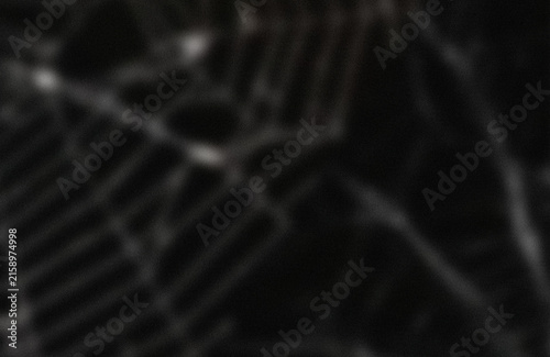 Abstract dark texture with subtle light spots