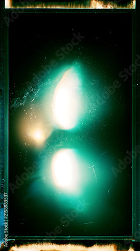 Abstract Cinematic Light Flare Over Dark Analog Film Texture Overlay