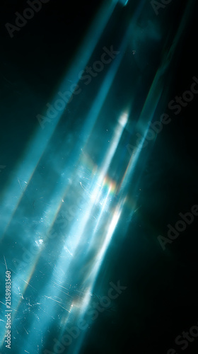 Vibrant abstract background with glowing diagonal blue light beams in dark atmosphere