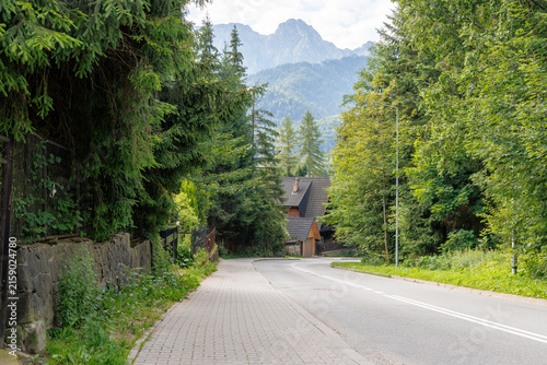 Empty Village Street Leading to Mountain Range