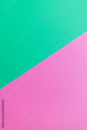 Obraz na płótnie Minimalist vertical two-tone background with diagonal split between vibrant mint green and soft pink paper