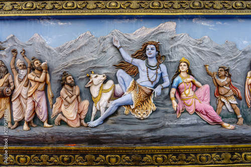 India. Uttarakhand. Haridwar. A bas-relief depicting the god Shiva and his wife Parvati seated in the Himalayan mountains