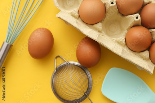 Canvastavla Tray of eggs, cooking ingredients and kitchen utensils on the table
