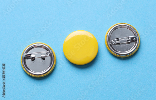 Yellow blank round pin button badge on blue background. Mockup template