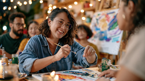 Art teacher in a candlelit community studio guiding a multicultural group of adult students through recreating traditional patterns from a culture not their own, cultural appropriation awareness ref