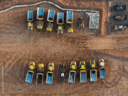 Heavy Construction Equipment Parked at a High Speed Rail Work Site During Sunset
