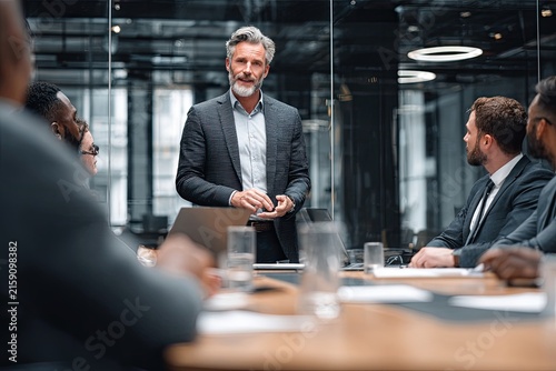 Business Team Meeting Leader Presents Ideas to Colleagues