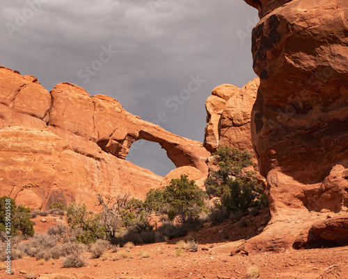 Quadro su tela Skyline Arch Beneath Dramatic Clouds in Arches National Park