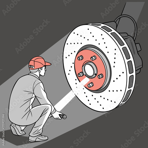 Mechanic using flashlight to inspect car wheel hub and brake disc assembly