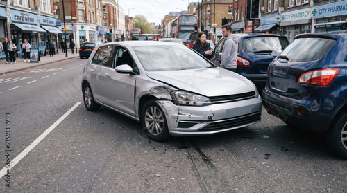 Damaged Car After Traffic Accident on Busy City Street