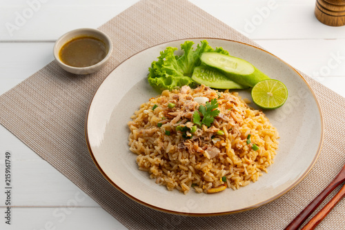 Crab Fried Rice.Thai fried rice with Crab Meat and egg in white plate.served with seafood dipping sauce.