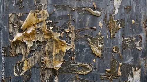 Abstract dark metal texture with peeling paint and rust patches