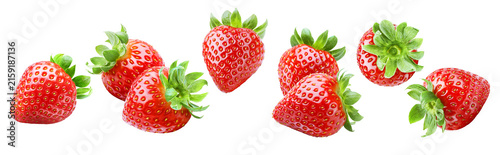 Whole and sliced strawberries floating separately in a horizontal row isolated on transparent background.