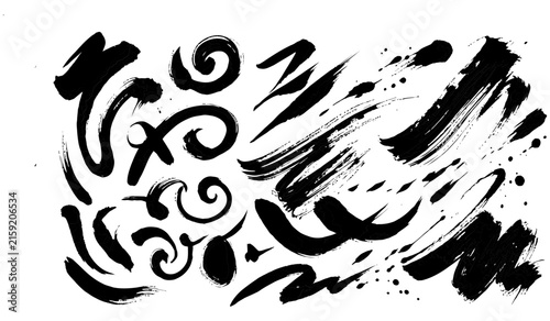 Black ink brush strokes and splatters on white background dynamic abstract shapes and artistic textures