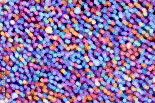 Colorful bokeh circles filling a purple and blue abstract background