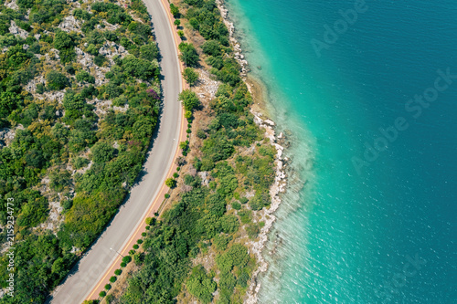 Antalya coastal road aerial drone view with a top down vertical perspective of the sea. Scenic turquoise Mediterranean landscape in Turkiye