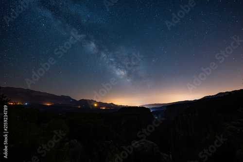 Obraz na plátne Vibrant Milky Way galaxy glowing across the deep cosmic night sky filled with countless stars