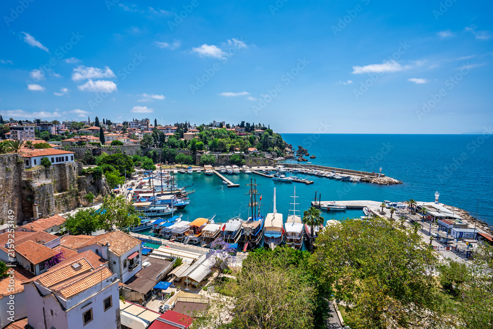Fototapeta premium Kaleici rooftops and old harbor viewed from an elevated terrace in Antalya, Turkey.