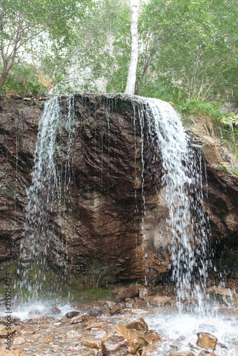 Bild auf Leinwand Mountain waterfall