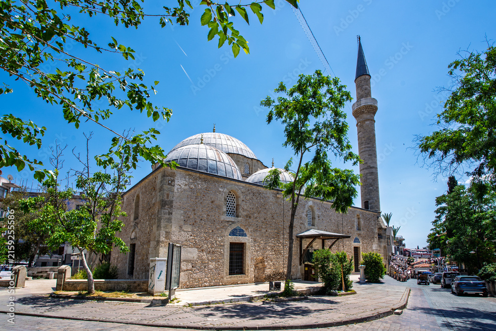 Fototapeta premium Wide view of a domed mosque and minaret in central Antalya, Turkey.