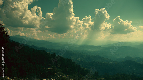 Mountain landscape in sunlight with clouds