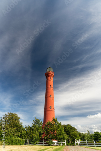 Pakri lighthouse tower under dramatic blue sky in Paldiski Estonia