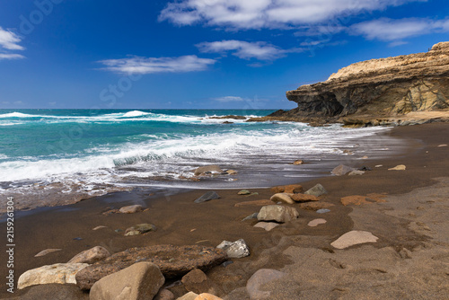 Rock formations and caves on the Atlantic Ocean coast in Ajuy, Fuerteventura, wallpaper or background for your project
