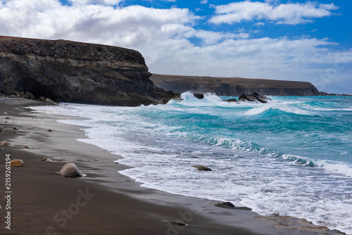 Rock formations and caves on the Atlantic Ocean coast in Ajuy, Fuerteventura, wallpaper or background for your project