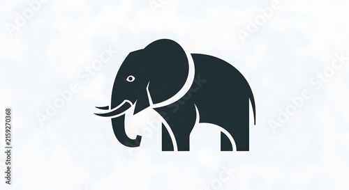 Stylized Elephant Silhouette: A minimalist, stylized silhouette of an elephant in a deep charcoal hue, showcasing its majestic form and tusks against a subtly textured, pale background.