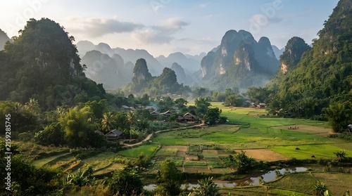 Scenic landscape with karst mountains and rural village in lush green valley southeast asia