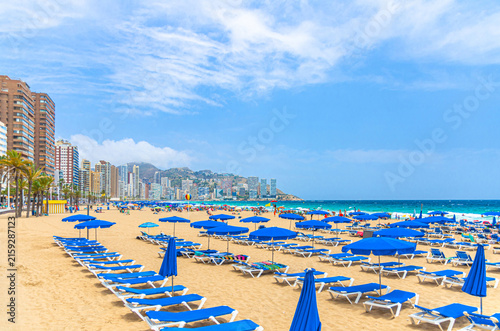 Fotografie Levante sandy beach with chaise lounge and umbrellas, Playa Platja De Llevant in
