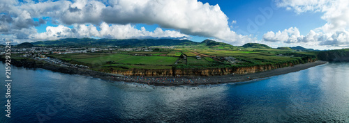 Aerial panoramic view of Praia de Santa Barbara, a long sandy surf beach on the north coast of Sao Miguel, Azores, Portugal.
