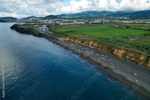 Aerial panoramic view of Praia de Santa Barbara, a long sandy surf beach on the north coast of Sao Miguel, Azores, Portugal.