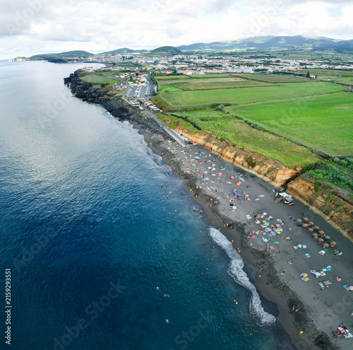 Aerial panoramic view of Praia de Santa Barbara, a long sandy surf beach on the north coast of Sao Miguel, Azores, Portugal.