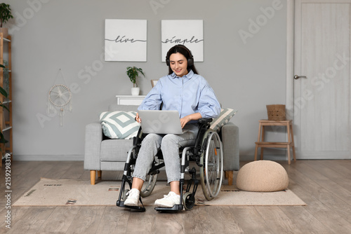 Young woman in wheelchair w...
