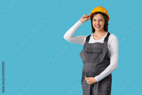 Young pregnant architect on...